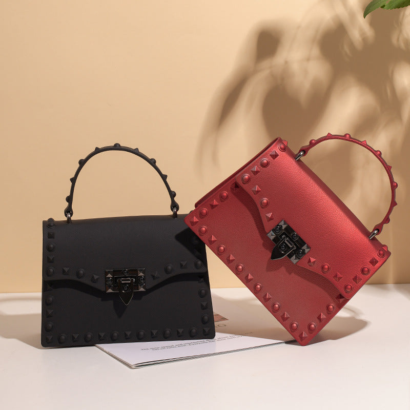 Sac à main en PVC pour femmes eprolo, sac à bandoulière coloré avec rivets en diamant et poignée, style diagonal.